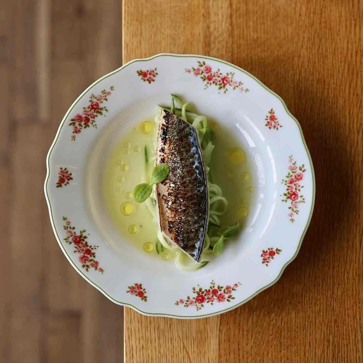 Charred mackerel on a floral plate at Caf&eacute; Cress, Amsterdam